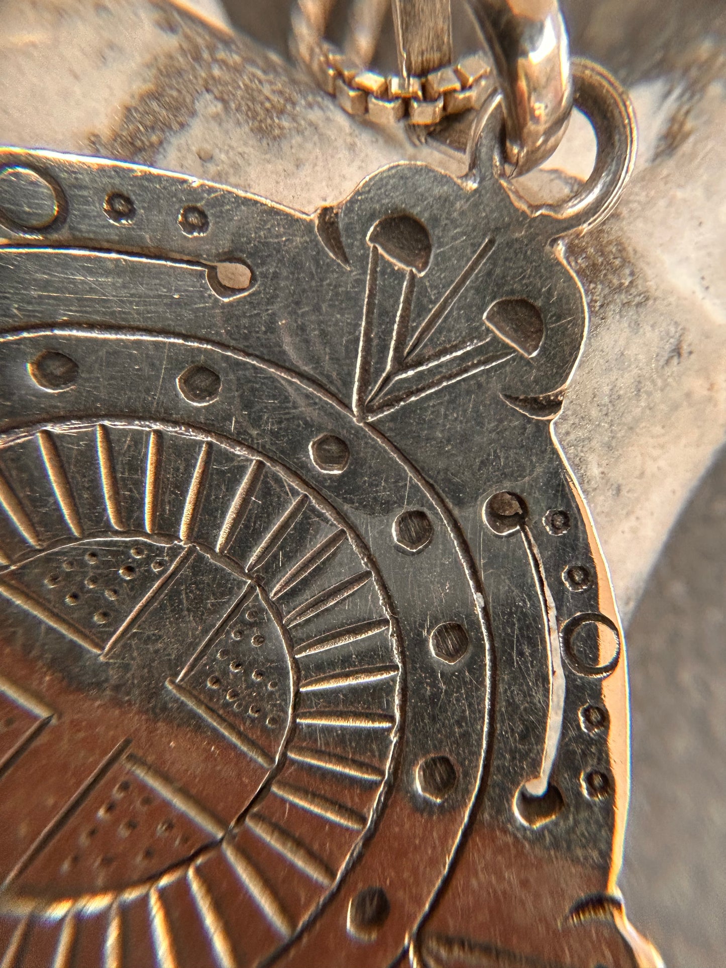 A captivating vintage sterling silver bohemian pendant featuring the ancient sun cross