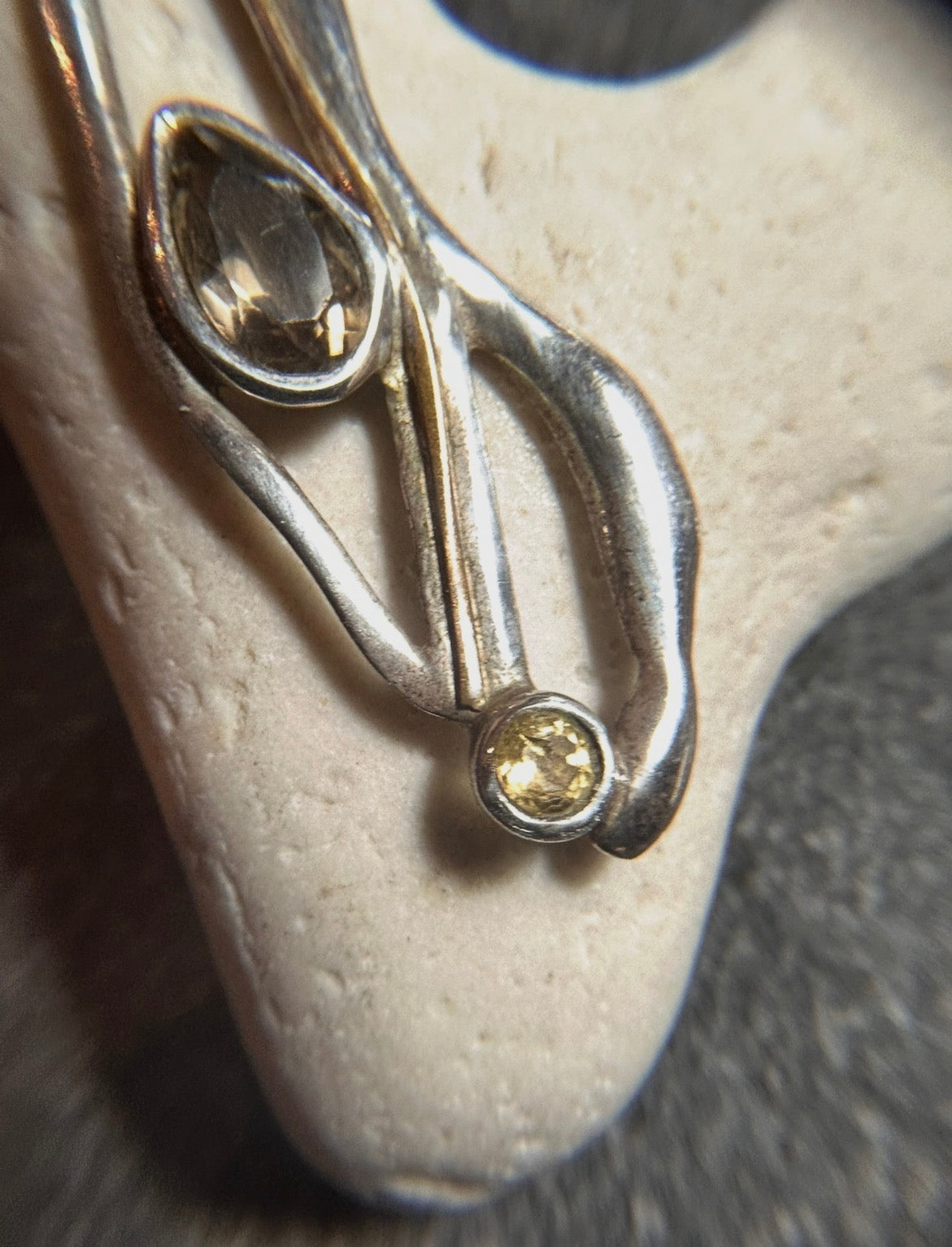 Vintage sterling silver artisan earrings with a graceful organic form.