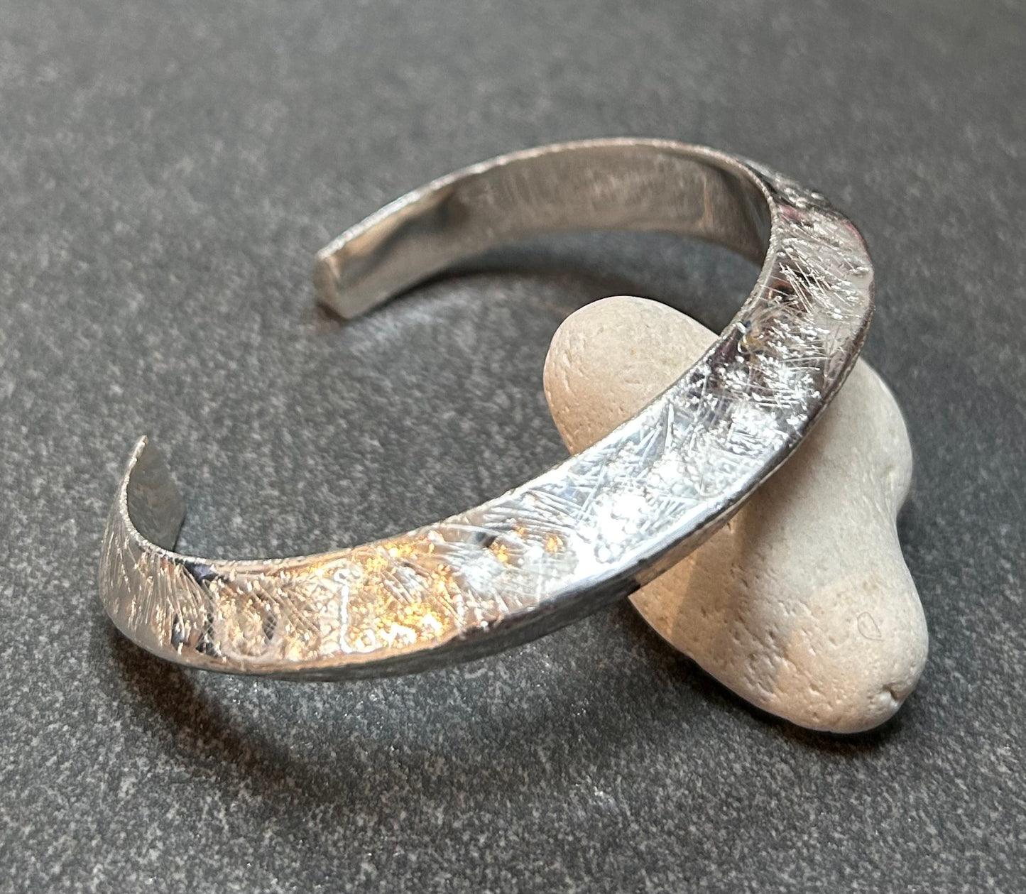 This vintage sterling silver artisan bangle is a one-off piece, alive with texture and character.