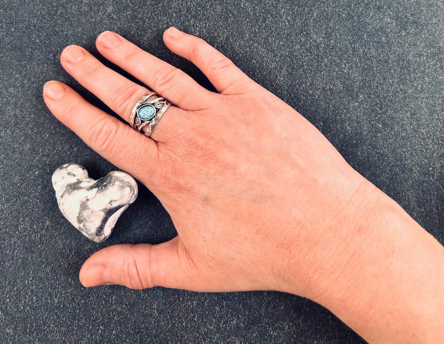 Vintage sterling silver artisan ring featuring a captivating lab-created opal