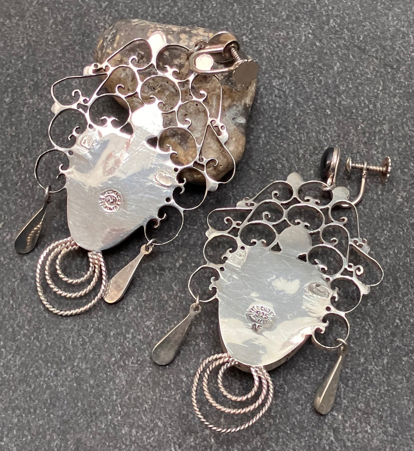 Absolutely spectacular vintage sterling silver Mexican warrior earrings.