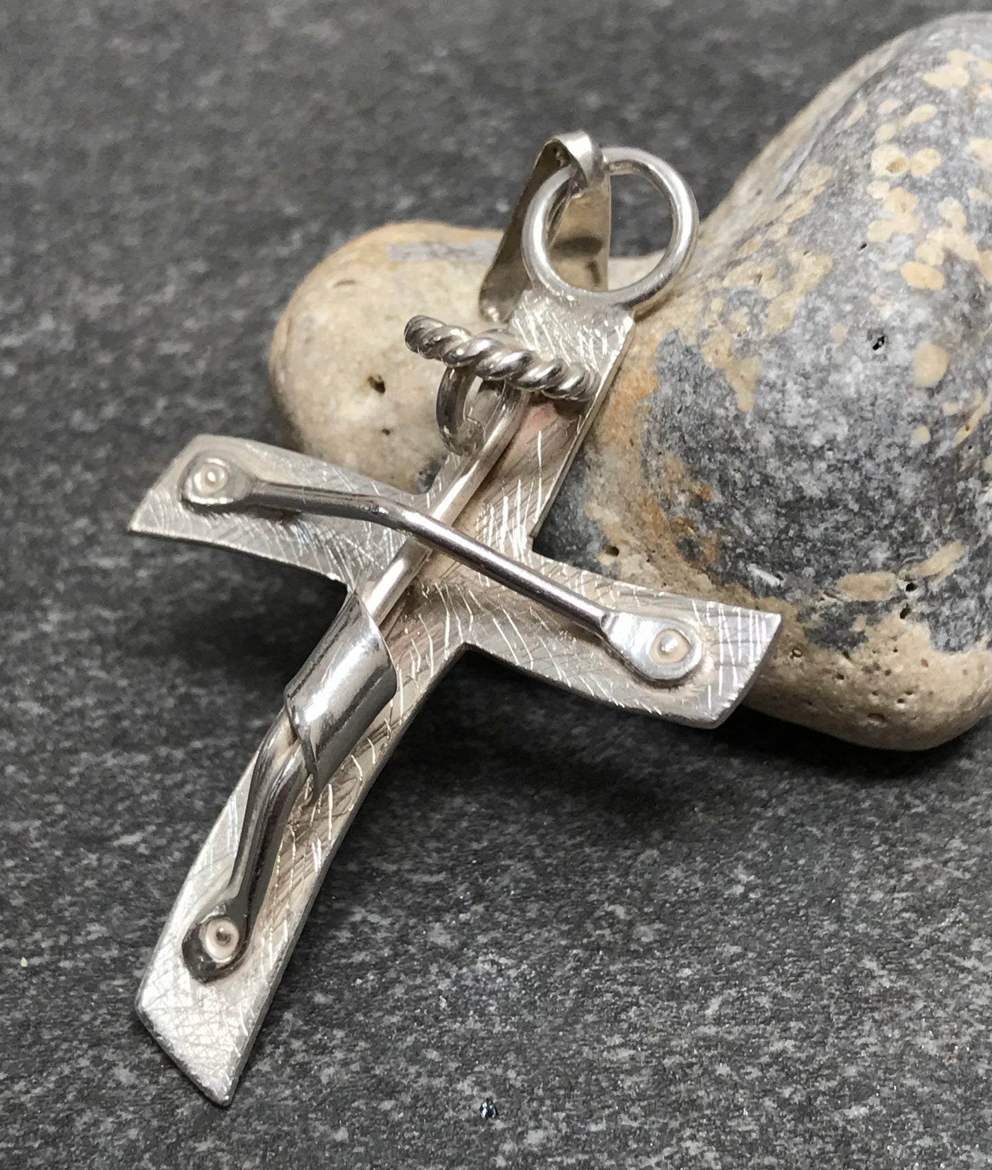 Brutalist modernist sterling silver vintage Mexican cross with a naive representation of Jesus.