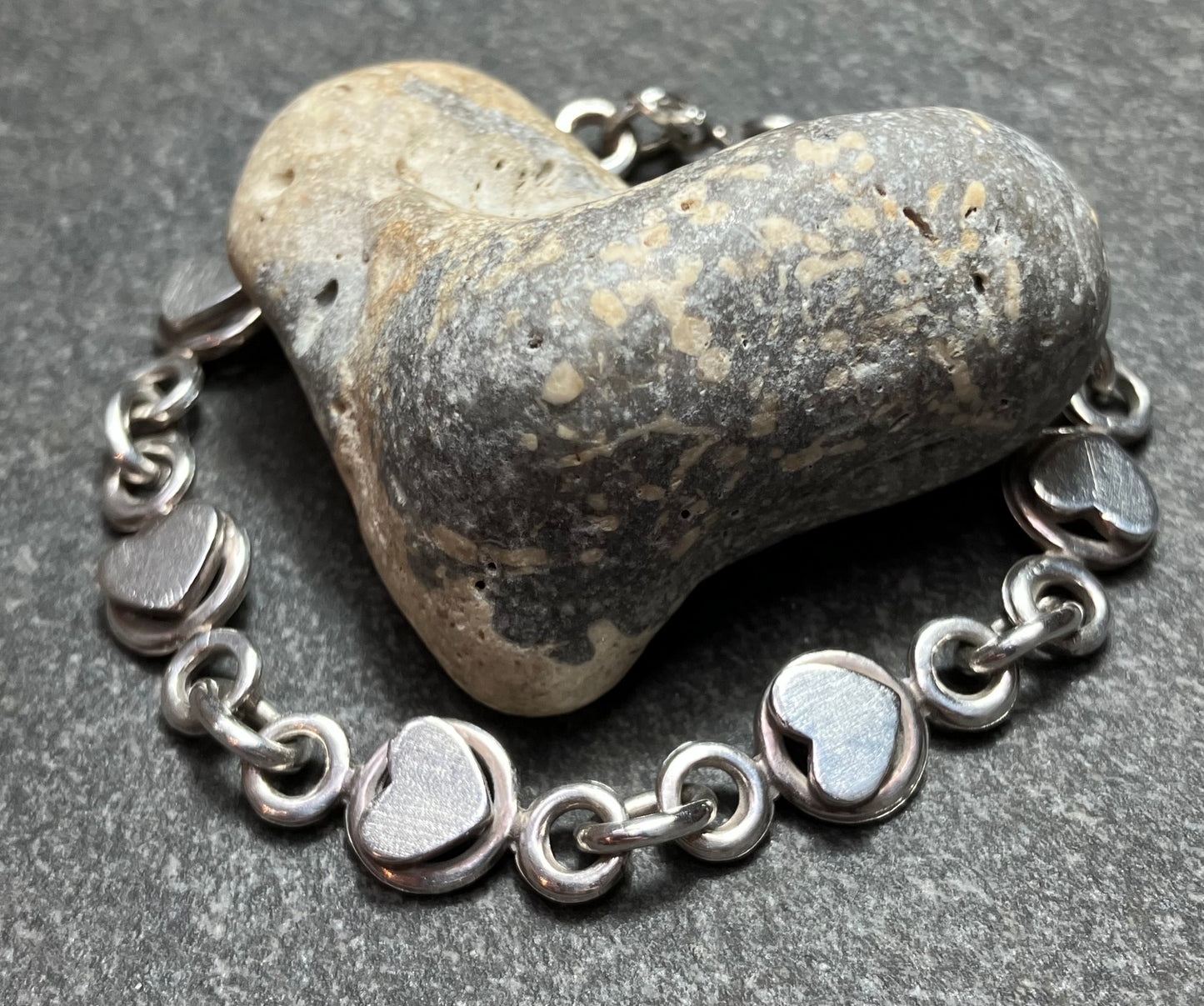 Absolutely beautifully made and constructed vintage sterling silver heart bracelet. 1981