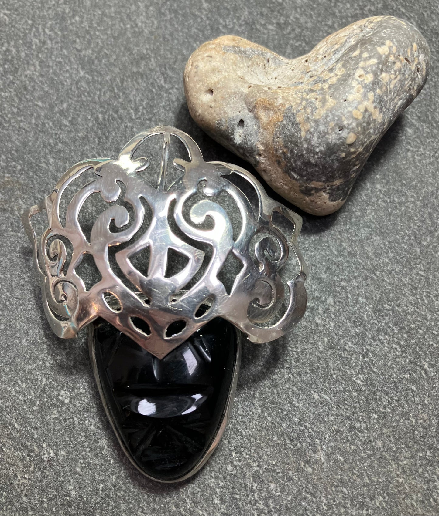 Vintage Mexican onyx and sterling silver warrior brooch.