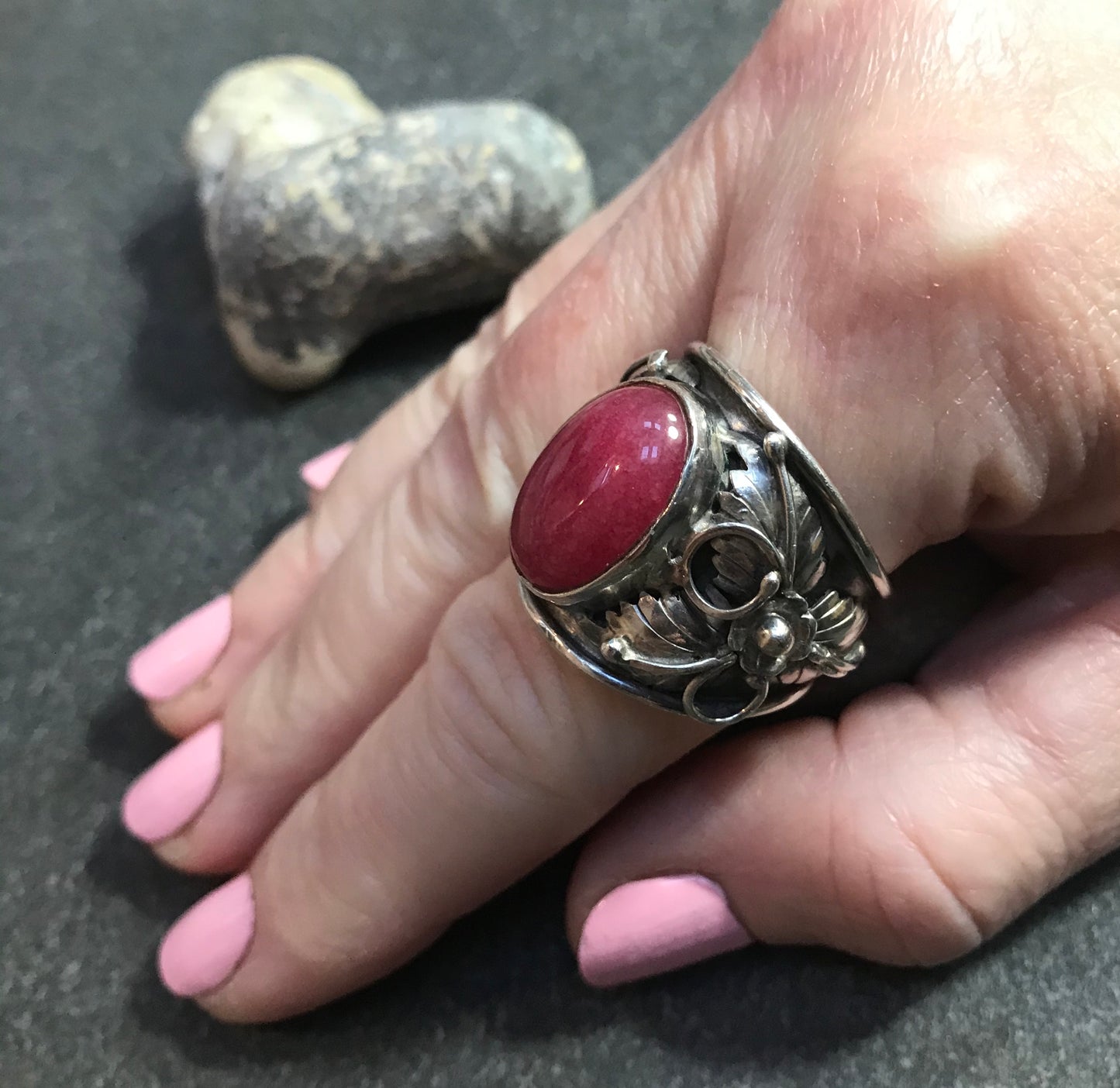 Spectacular statement vintage sterling silver Ruby cabochon with beautiful 3D floral detail at each side.