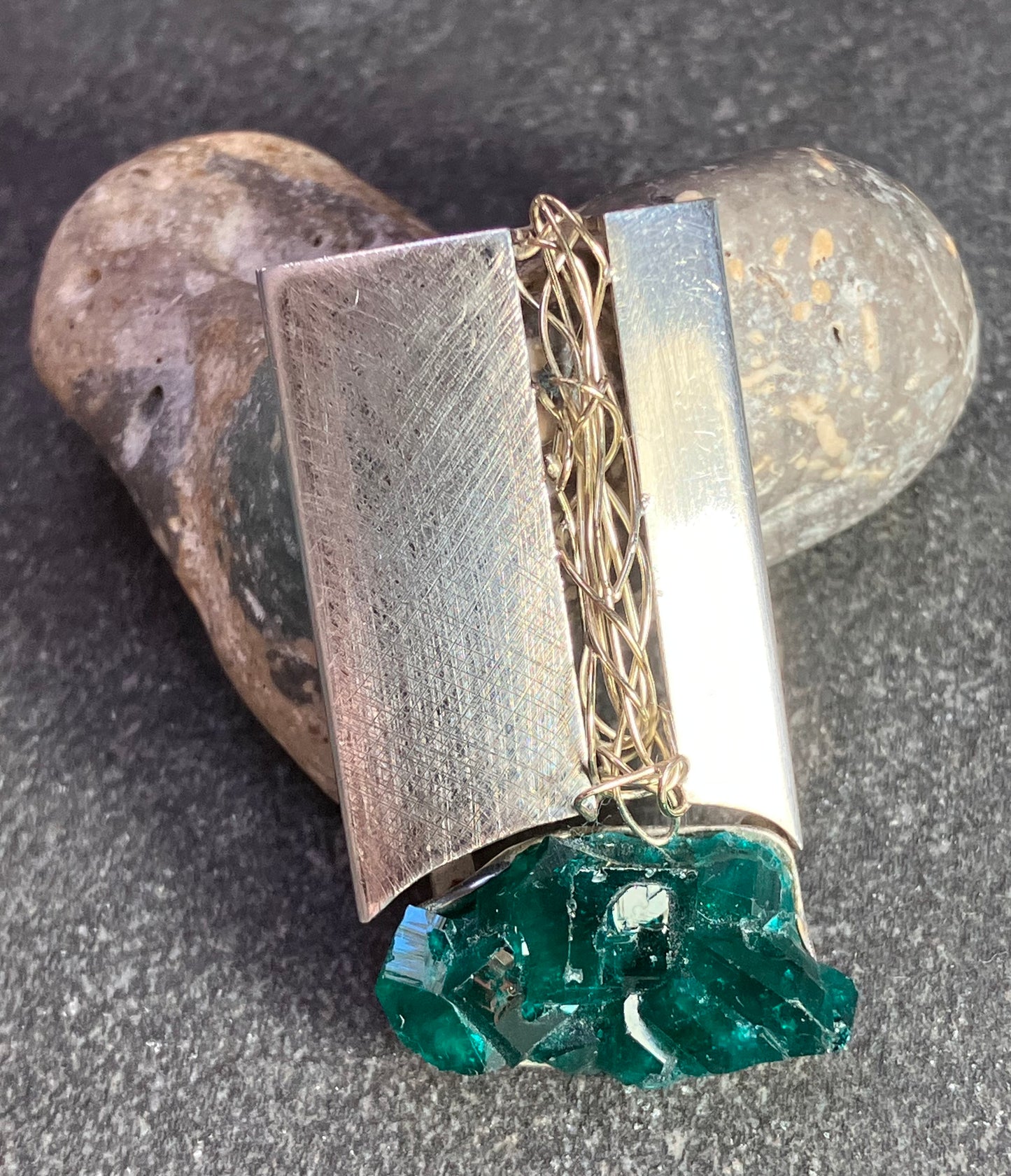 Unique vintage artisan sterling silver pendant with Green Tourmaline crystal.