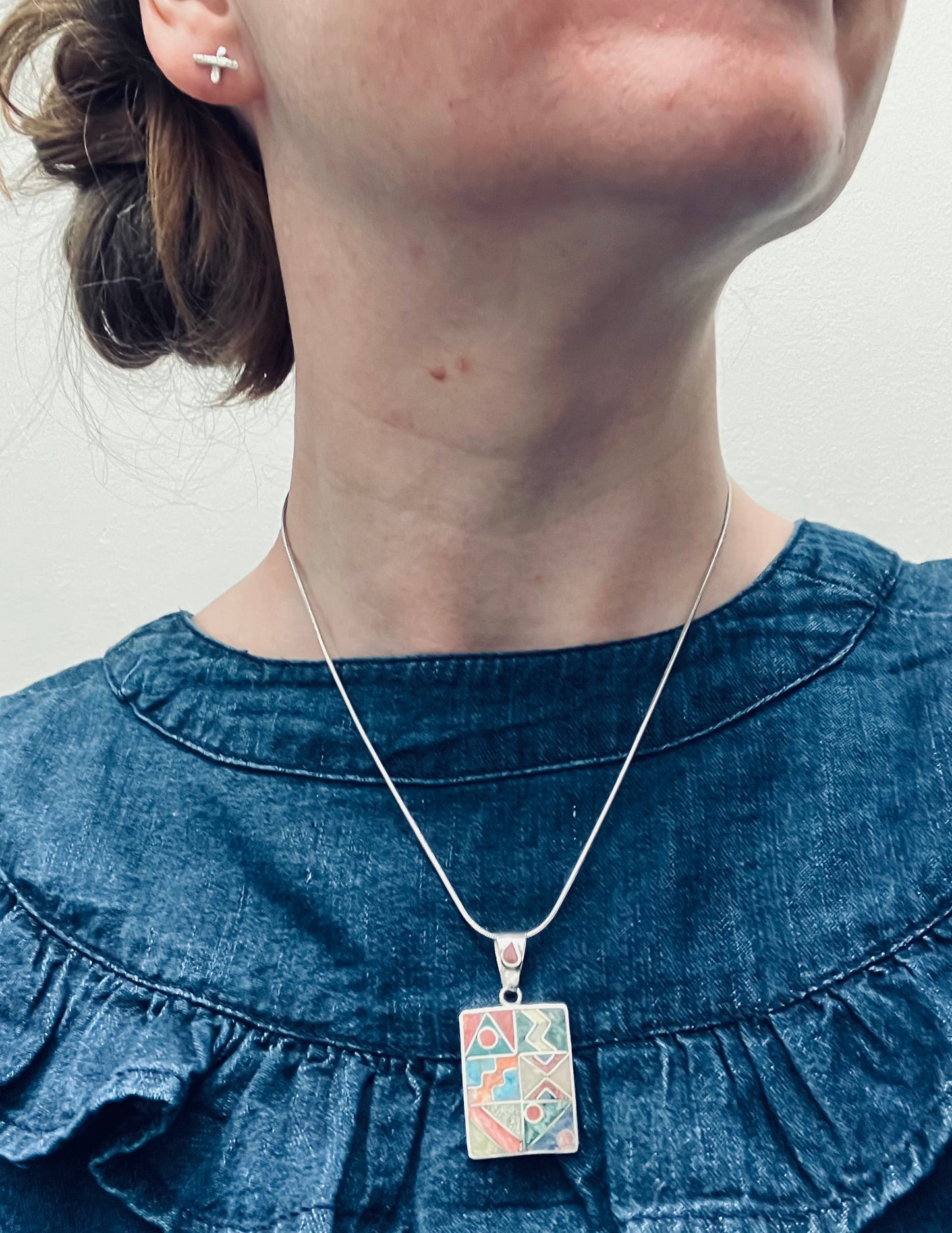 Vintage Native American inlaid stone and sterling silver pendant.