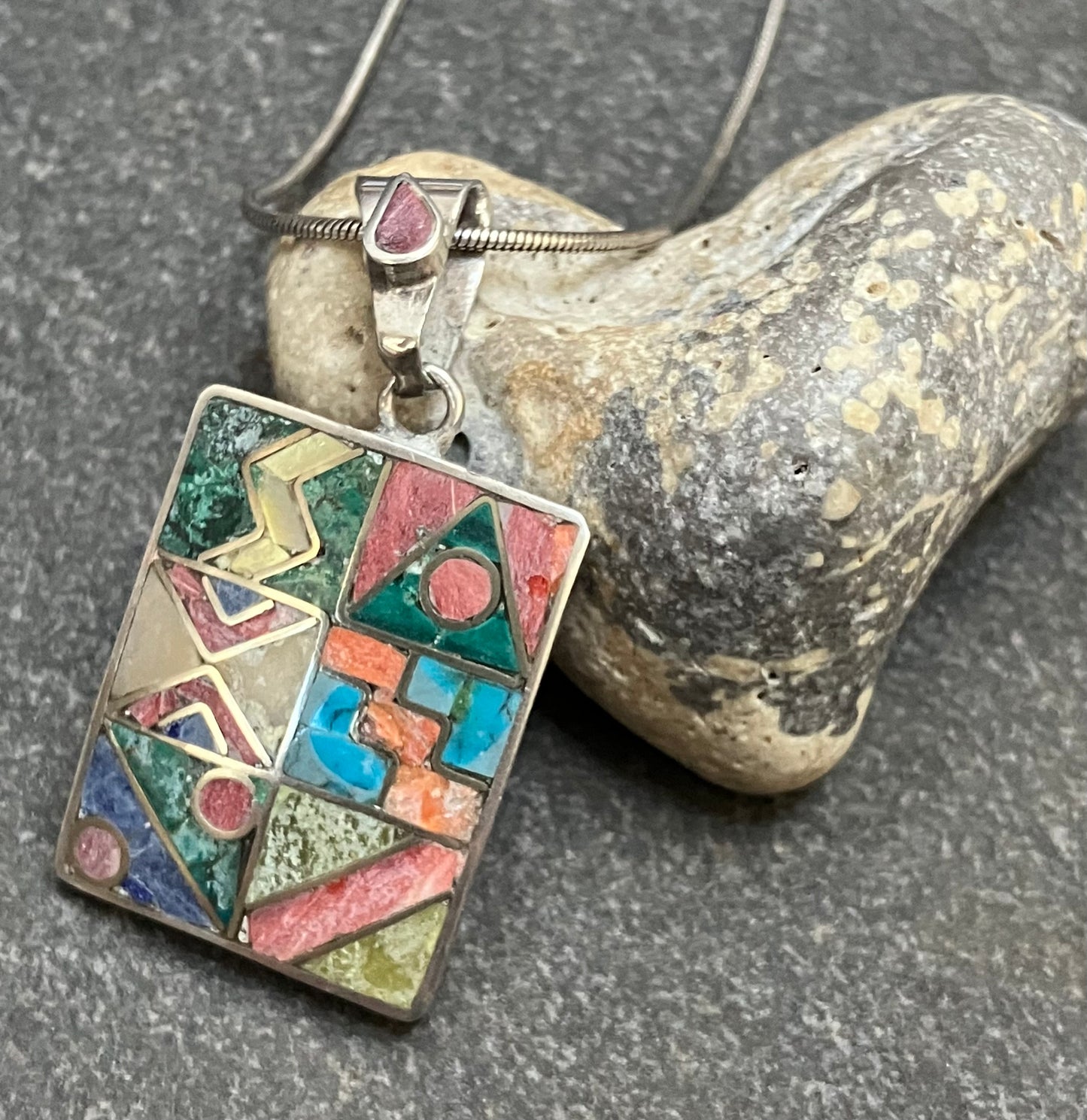 Vintage Native American inlaid stone and sterling silver pendant.