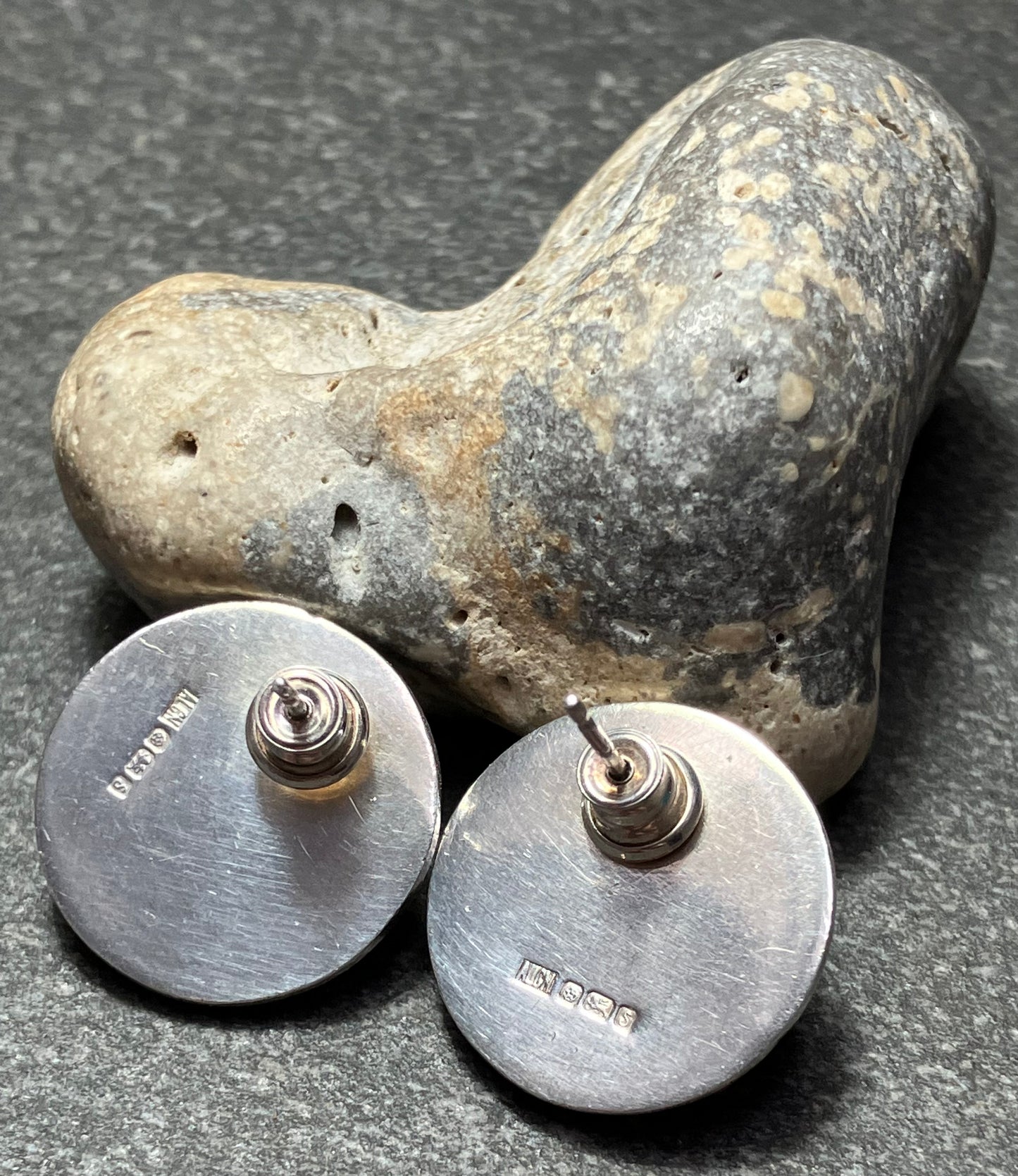 Fantastic artisan sterling silver earrings with finely pierced zigzag design into the domed surface. 1992