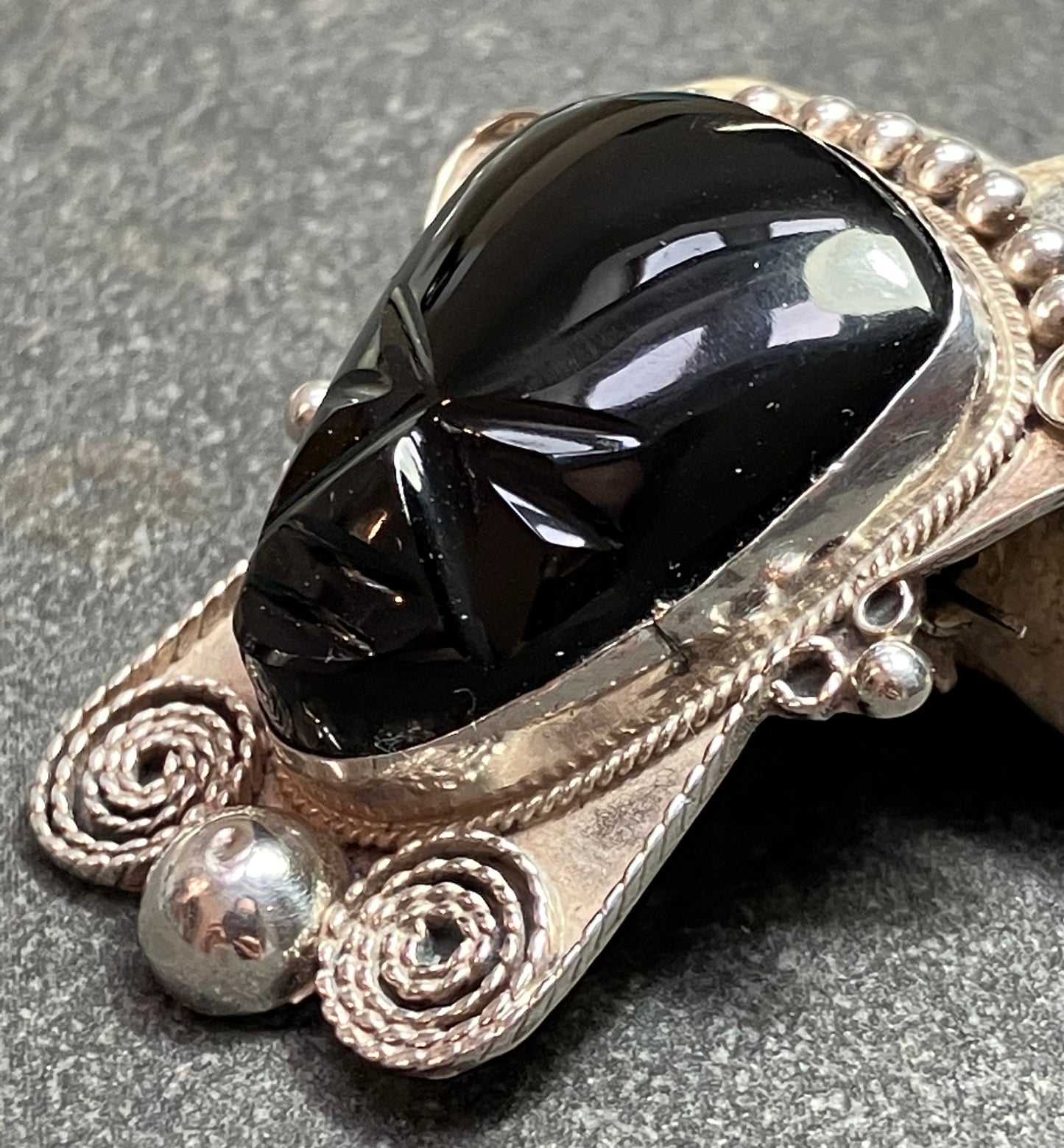 Vintage Mexican onyx and sterling silver warrior brooch.