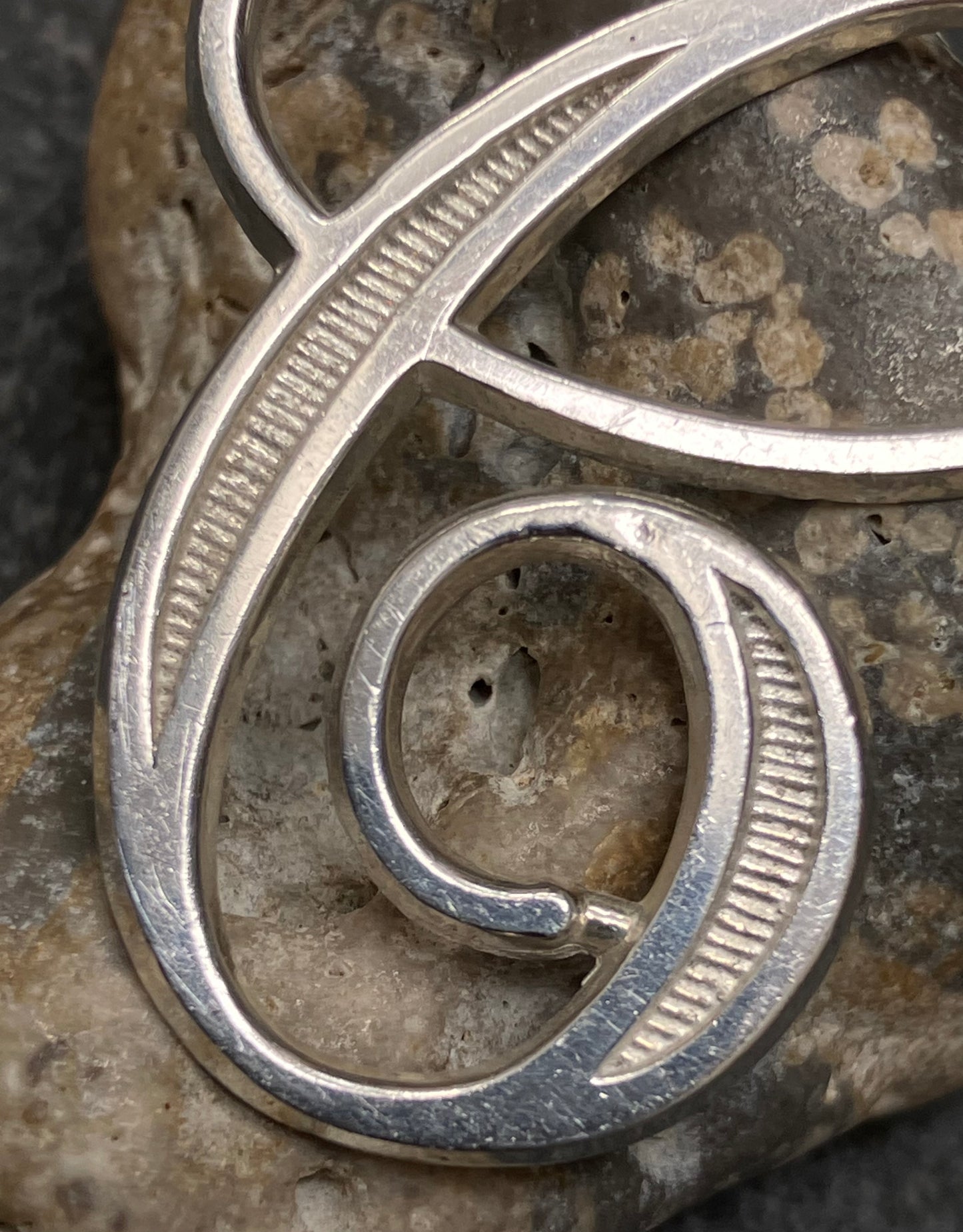 Vintage sterling silver ‘e’ pendant.