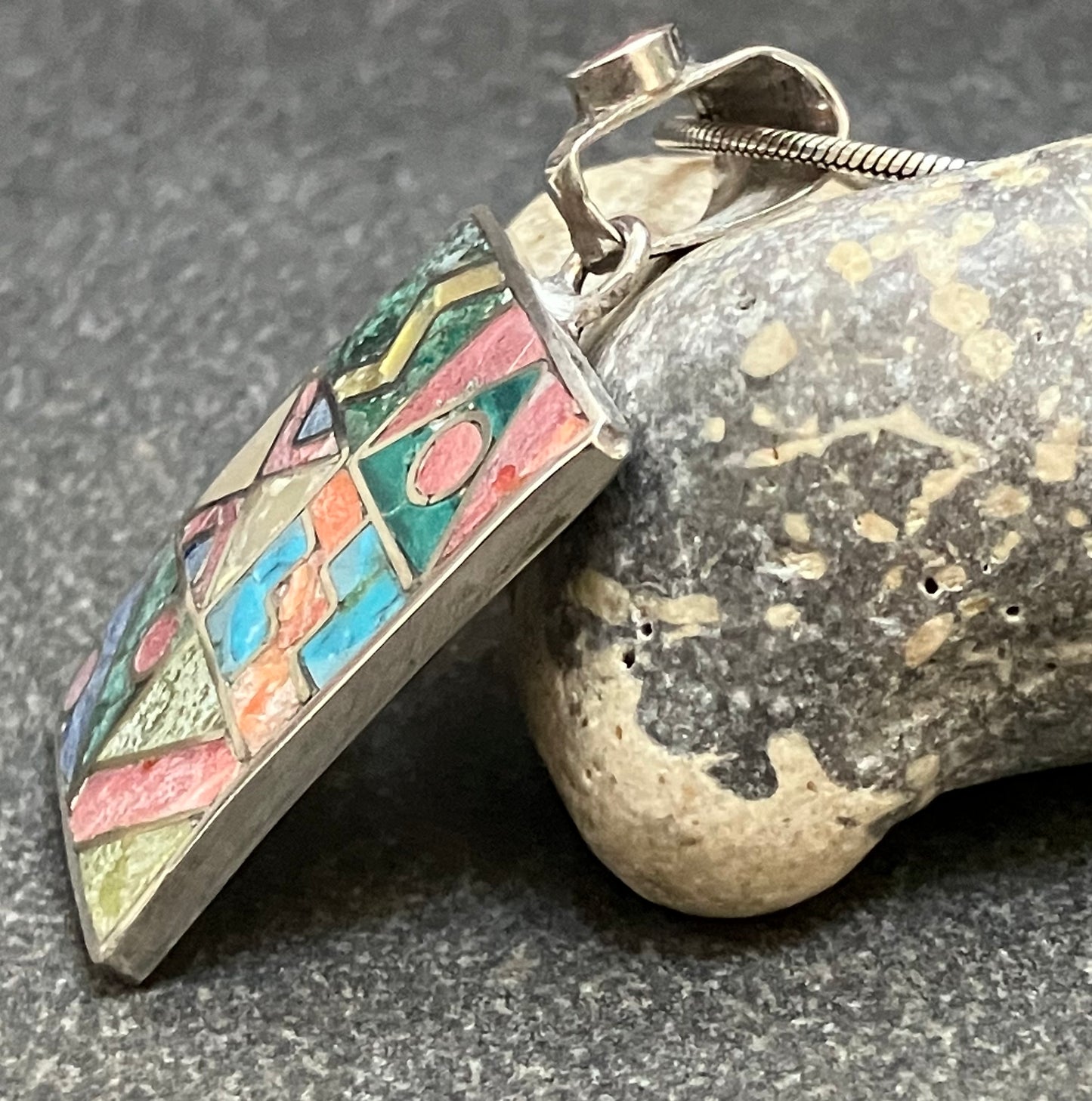 Vintage Native American inlaid stone and sterling silver pendant.