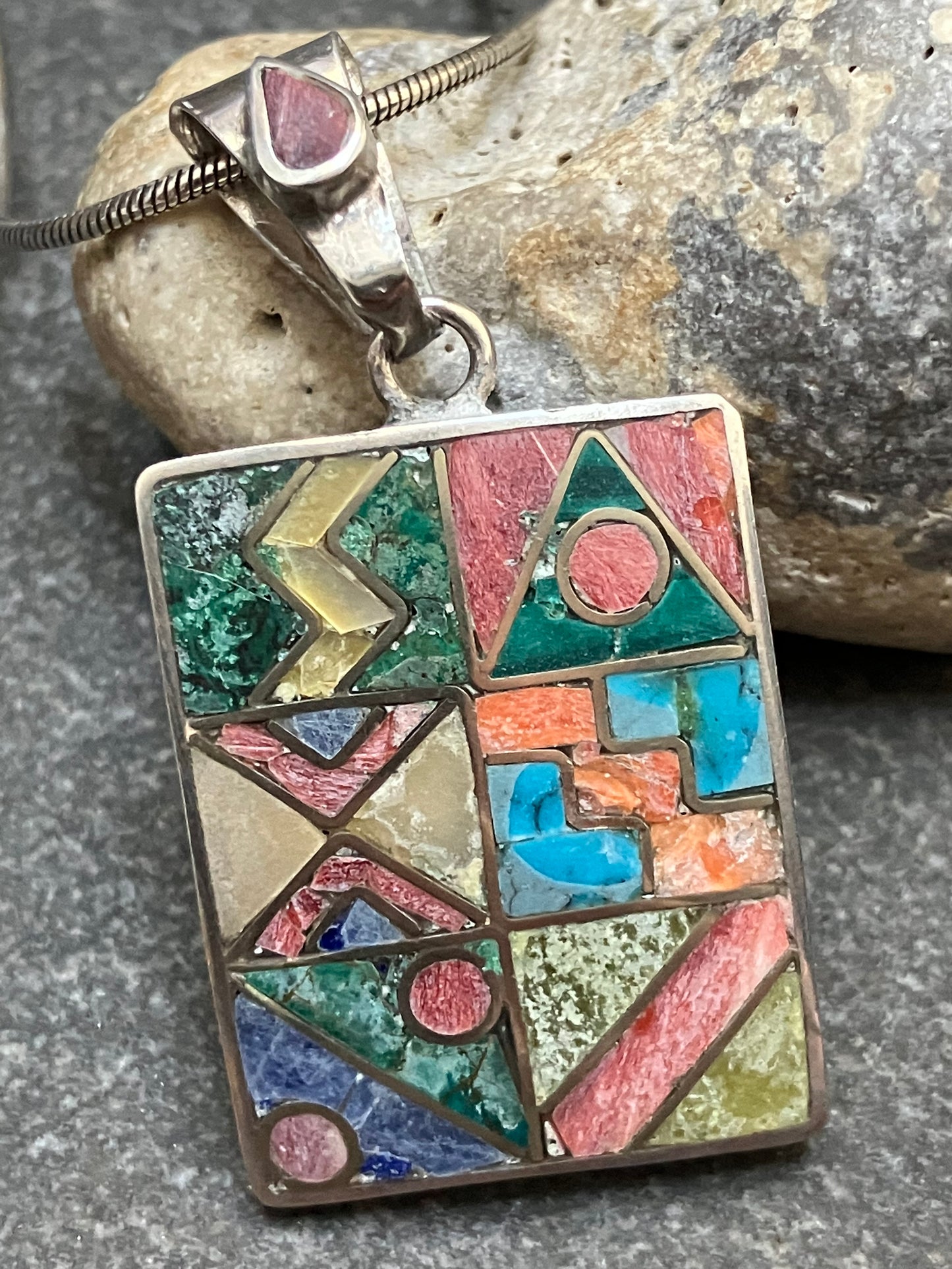 Vintage Native American inlaid stone and sterling silver pendant.