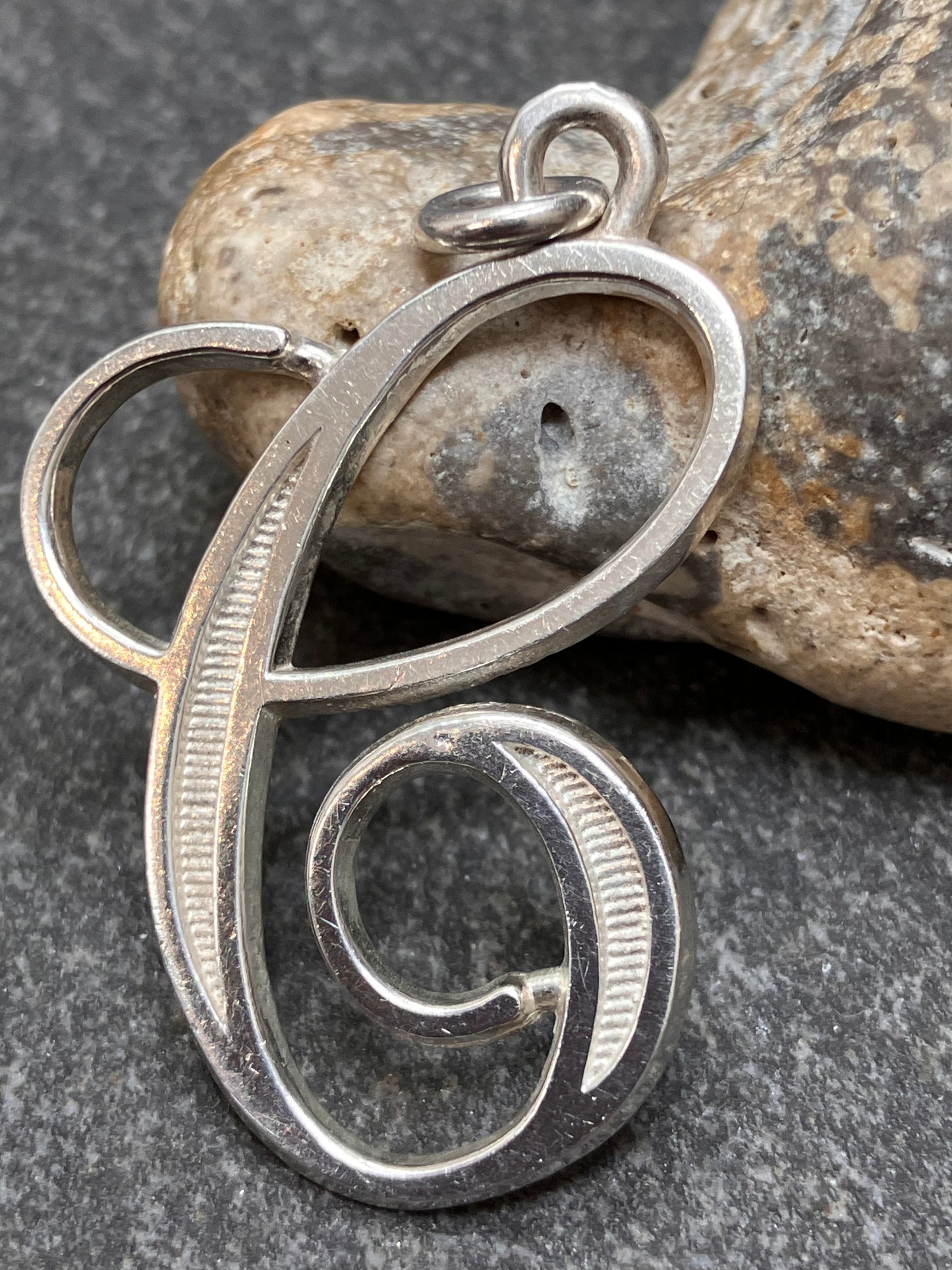 Vintage sterling silver ‘e’ pendant.