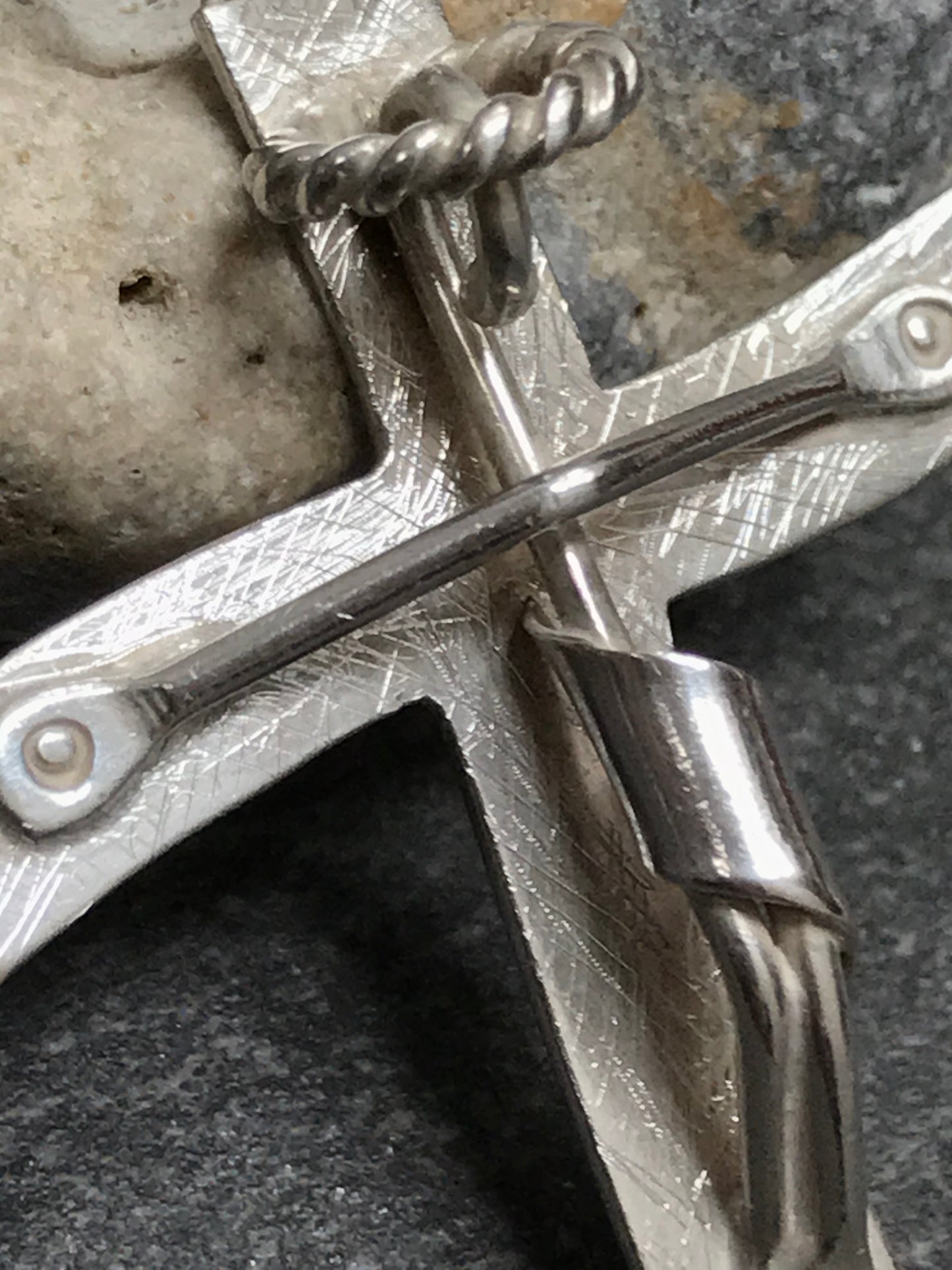 Brutalist modernist sterling silver vintage Mexican cross with a naive representation of Jesus.