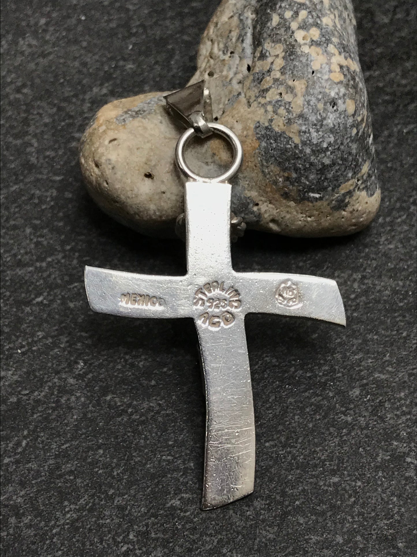 Brutalist modernist sterling silver vintage Mexican cross with a naive representation of Jesus.