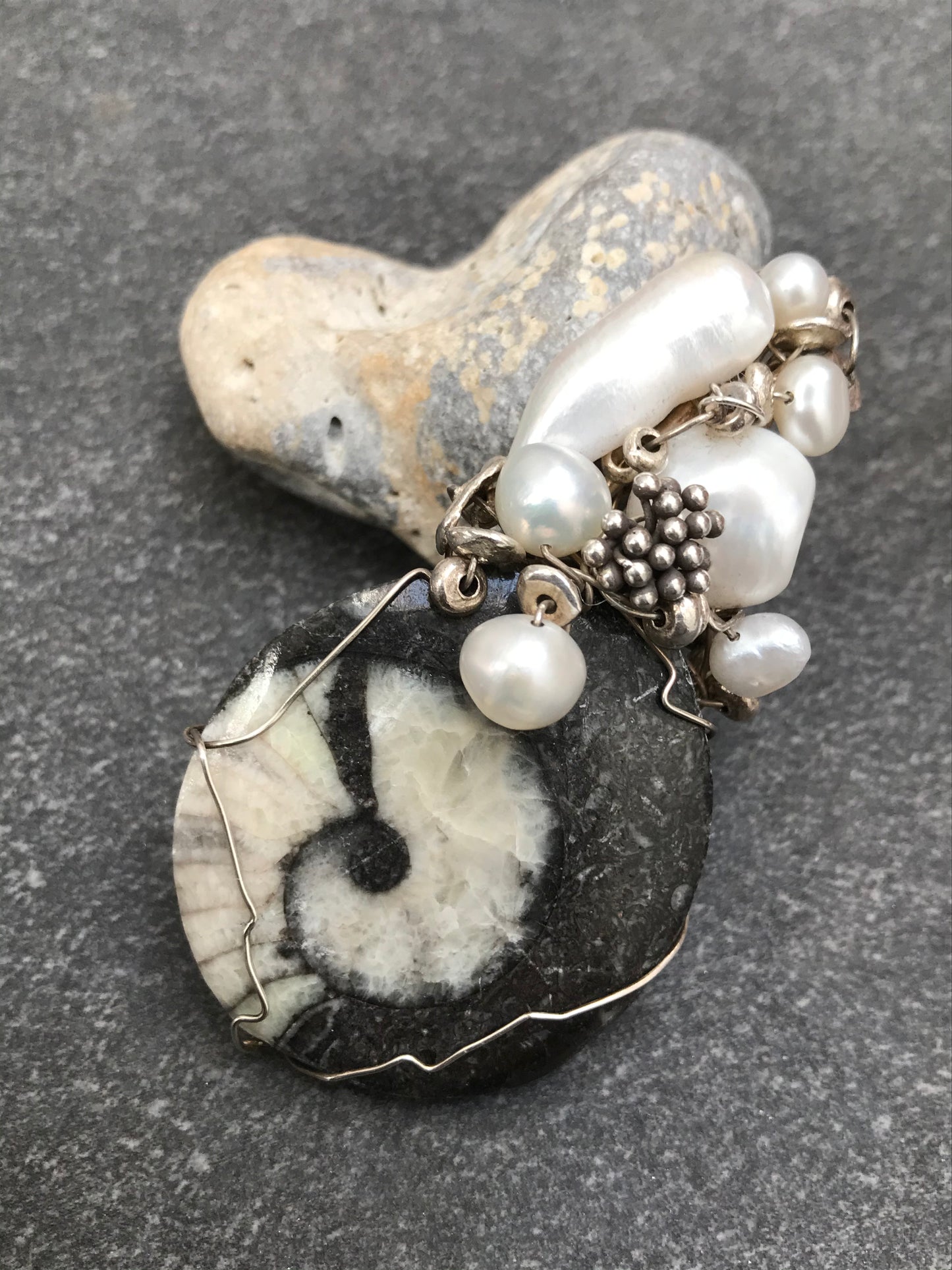 Unique handmade ammonite fossil, pearl and silver pendant.