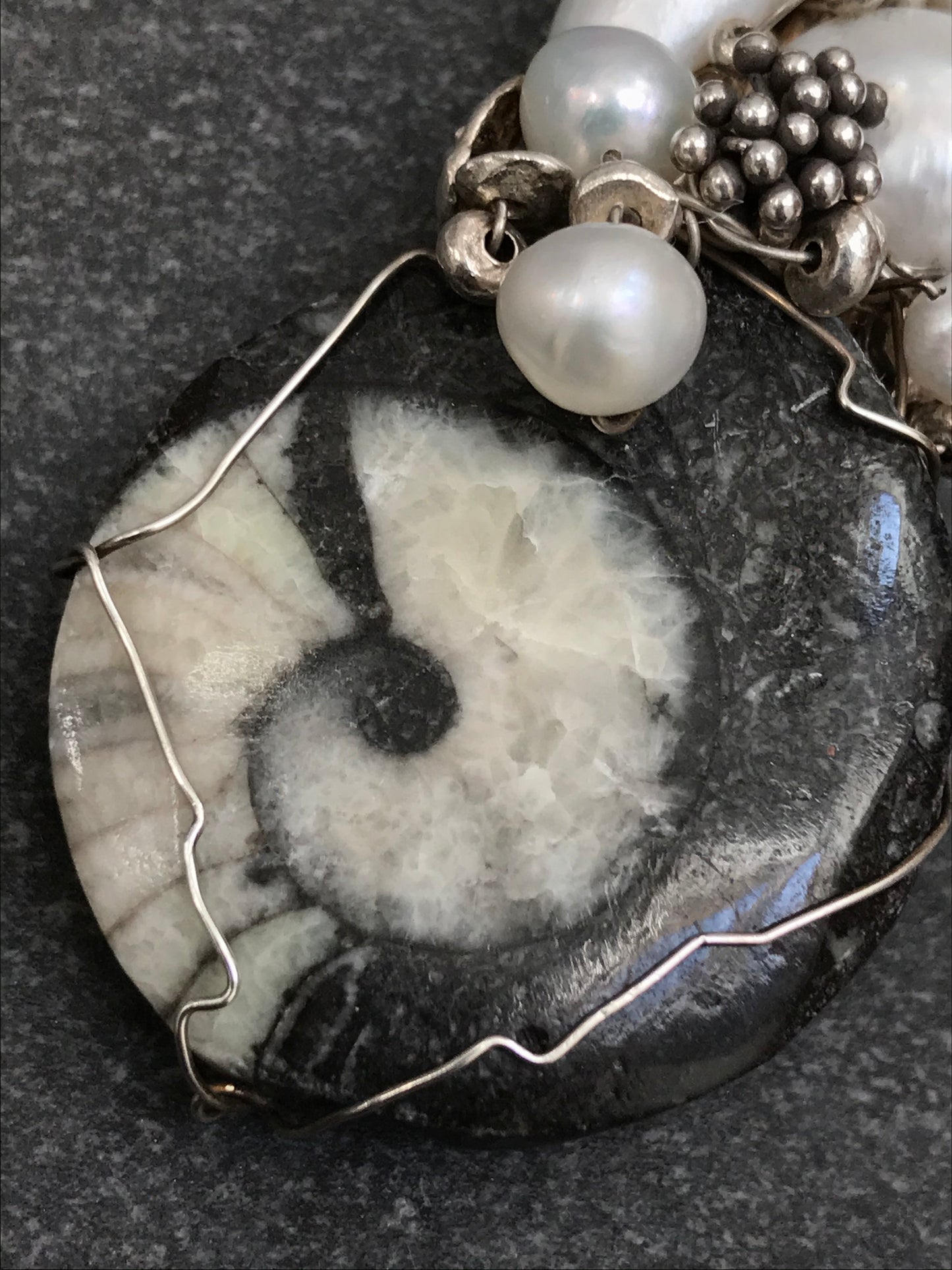 Unique handmade ammonite fossil, pearl and silver pendant.