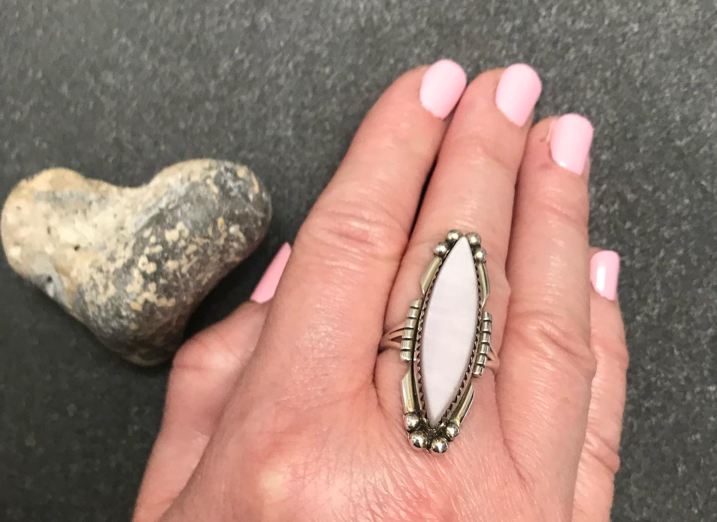 Vintage Native American sterling silver ring with mother of pearl set in a zig zag bezel setting.