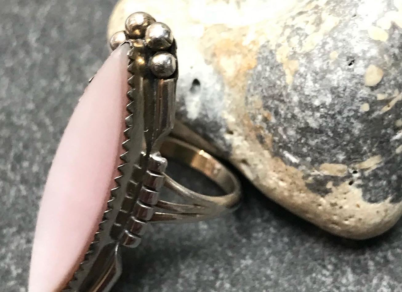 Vintage Native American sterling silver ring with mother of pearl set in a zig zag bezel setting.