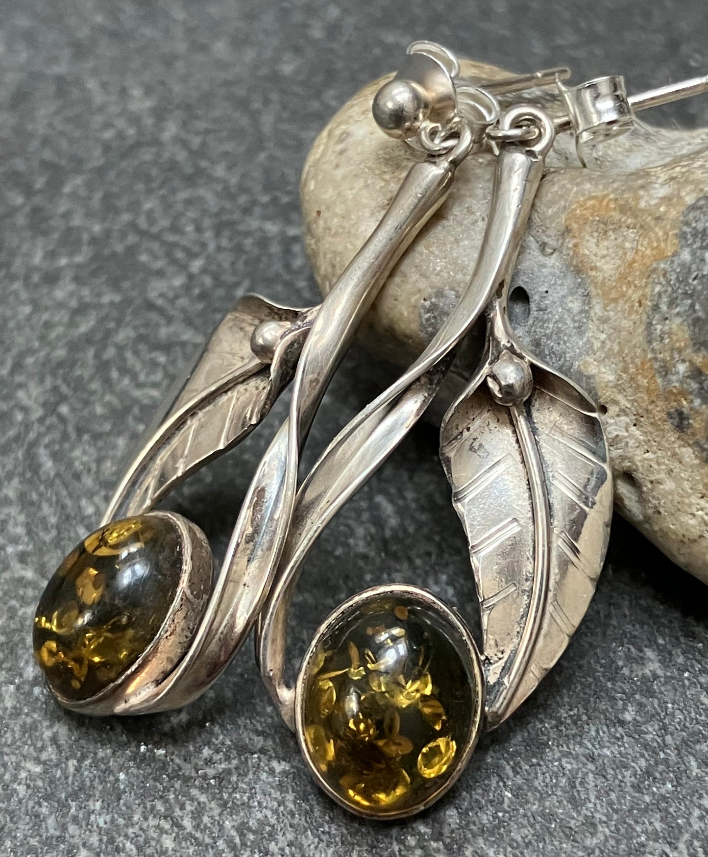 Vintage sterling silver and amber cabochon stone earrings.