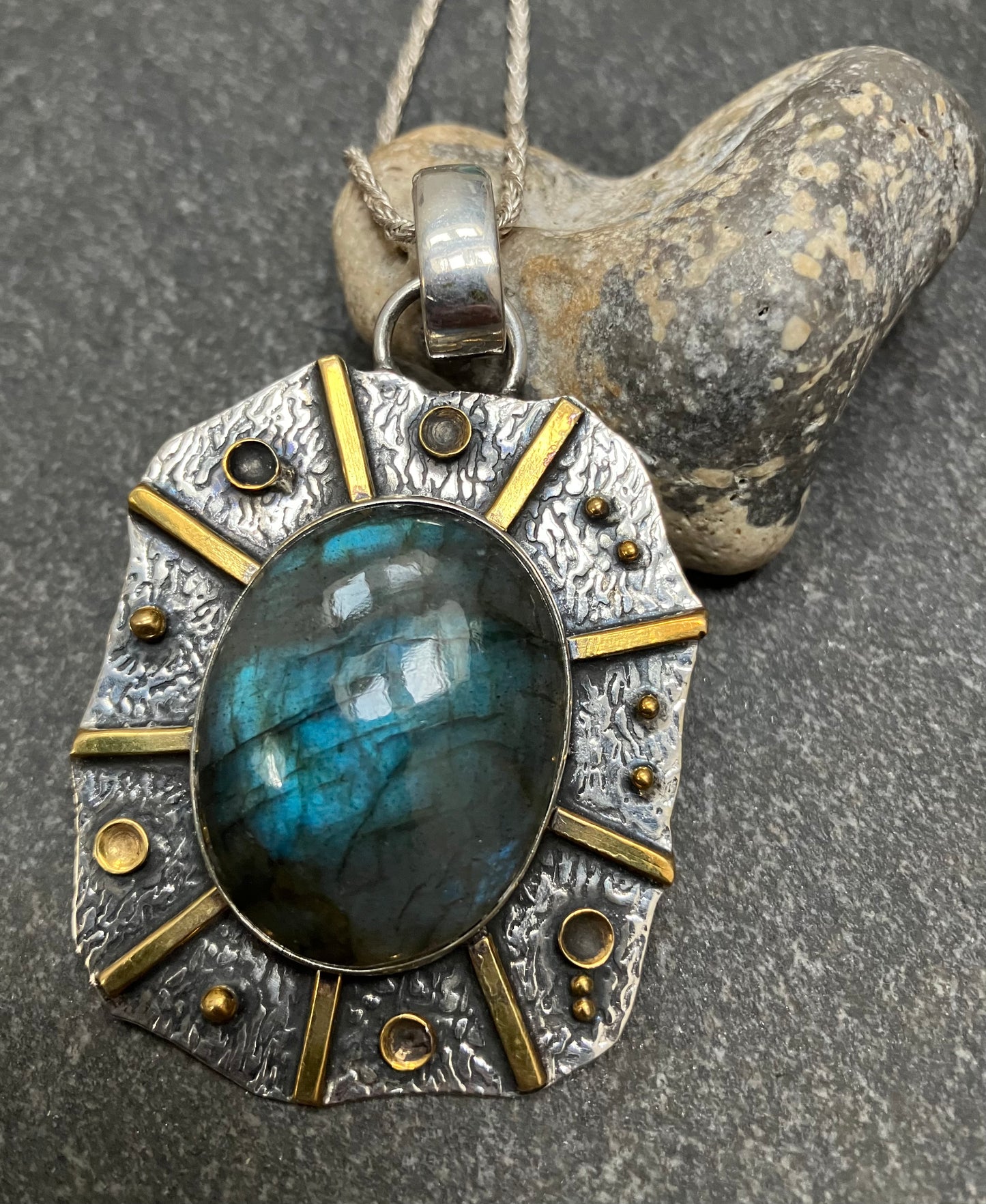 Artisan sun pendant with Labradorite cabochon.