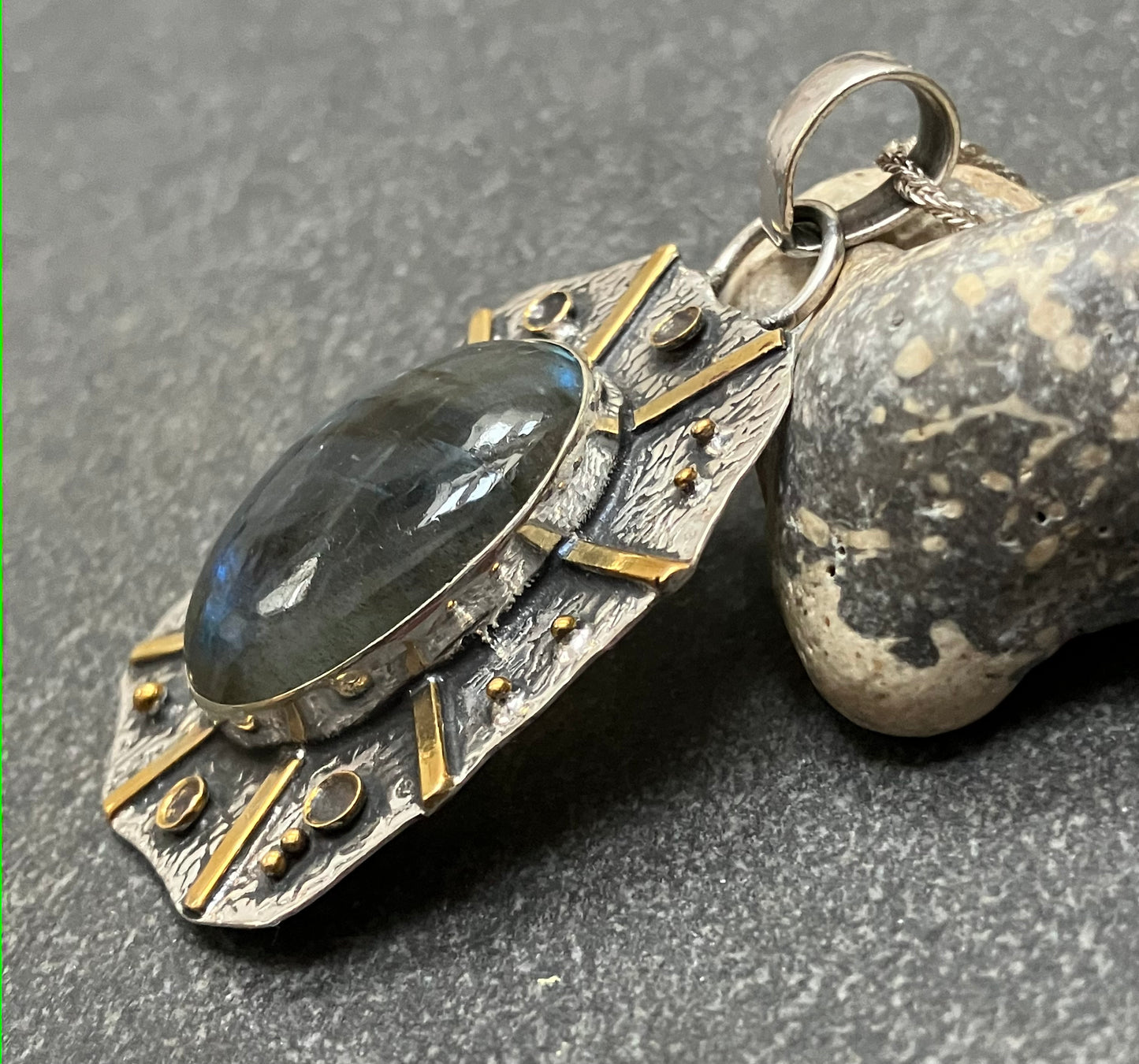 Artisan sun pendant with Labradorite cabochon.